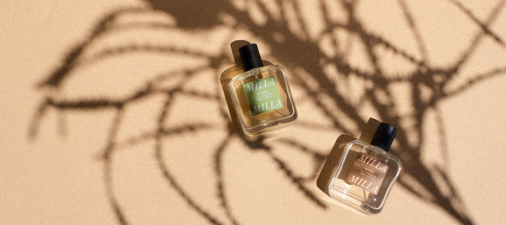 Milla Milla perfume Nowhere and September bottles with native flower shadows